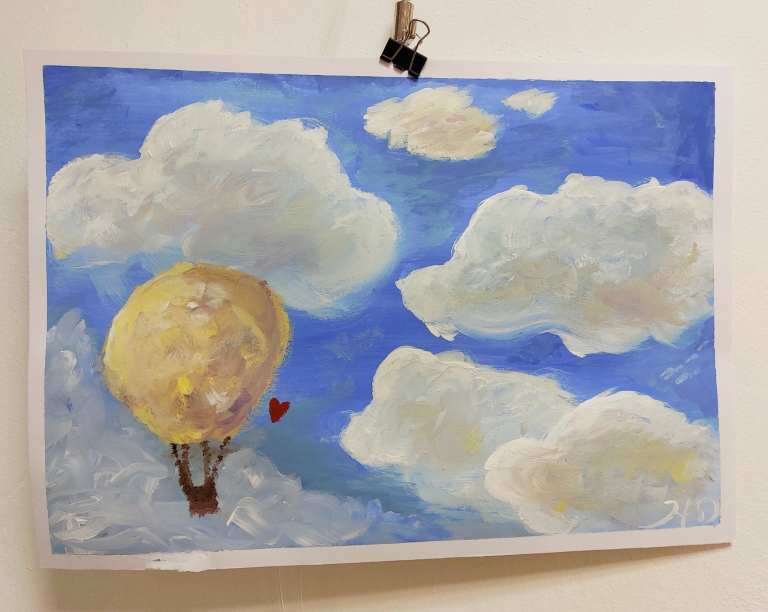 Bild mit Luftballon in Wolken